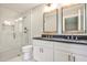 Modern bathroom with double vanity, granite countertops, and tiled walk-in shower at 1741 Hasty Rd, Marietta, GA 30062