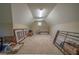 Spacious attic featuring neutral paint, carpet flooring, and a small window at 20 Rivercreek Xing, Kingston, GA 30145