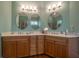 Double sink vanity with a light countertop and wooden cabinets at 20 Rivercreek Xing, Kingston, GA 30145