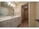 Bathroom with white cabinets, a white countertop, and a large mirror at 20 Rivercreek Xing, Kingston, GA 30145