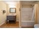 Modern bathroom featuring a sleek vanity and shower-tub combination with a white shower curtain at 20 Rivercreek Xing, Kingston, GA 30145