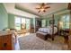 Spacious bedroom with tray ceiling, and large windows showcasing picturesque views at 20 Rivercreek Xing, Kingston, GA 30145