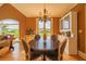 Elegant dining room with chandelier, hardwood floors, and scenic views at 20 Rivercreek Xing, Kingston, GA 30145