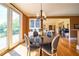 Dining room with chandelier, hardwood floors and patio door leading to the deck at 20 Rivercreek Xing, Kingston, GA 30145
