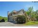 Spacious home with a three-car garage and stone accents, set on a well-maintained lawn with mature trees at 20 Rivercreek Xing, Kingston, GA 30145