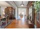 Elegant foyer featuring gleaming hardwood floors, classic decor, and an inviting atmosphere throughout the home at 20 Rivercreek Xing, Kingston, GA 30145