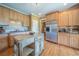 Spacious kitchen with stainless steel appliances, island, and custom wood cabinets at 20 Rivercreek Xing, Kingston, GA 30145