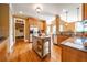 Bright kitchen featuring stainless steel appliances, granite countertops, a central island and mud room access at 20 Rivercreek Xing, Kingston, GA 30145