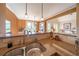 Granite countertops, tile backsplash, and stainless steel sink in this well-appointed kitchen at 20 Rivercreek Xing, Kingston, GA 30145
