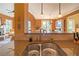 Stylish kitchen with granite countertops, double sinks, and pendant lighting, offering a blend of functionality and design at 20 Rivercreek Xing, Kingston, GA 30145