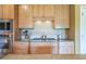 Gourmet kitchen featuring stainless steel appliances and custom maple cabinetry at 20 Rivercreek Xing, Kingston, GA 30145