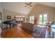 Cozy living room with a piano, hardwood floors, and French doors leading to a private outdoor space at 20 Rivercreek Xing, Kingston, GA 30145