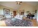 Inviting living room with comfortable seating, a grand piano, and elegant furnishings, creating a sophisticated ambiance at 20 Rivercreek Xing, Kingston, GA 30145