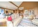 Open-concept living room with hardwood floors, comfortable seating, and a view into the dining and kitchen areas at 20 Rivercreek Xing, Kingston, GA 30145