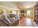 Spacious living room featuring tile flooring, comfortable leather furniture, and bright windows at 20 Rivercreek Xing, Kingston, GA 30145
