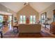 Bright living room with vaulted ceilings, hardwood floors, and French doors leading to a private outdoor space at 20 Rivercreek Xing, Kingston, GA 30145