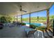 Cozy covered patio featuring comfortable seating, ceiling fan, and relaxing views of the pool and backyard at 20 Rivercreek Xing, Kingston, GA 30145