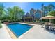 Inviting in-ground pool with stone surround, hot tub, and outdoor dining area at 20 Rivercreek Xing, Kingston, GA 30145