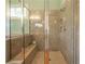 Tiled shower with glass enclosure, built-in bench, and modern fixtures at 20 Rivercreek Xing, Kingston, GA 30145