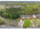 Aerial view of townhouses nestled in a wooded community with lush trees and landscaping at 3355 Waldrop Trl, Decatur, GA 30034