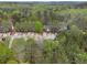 An aerial shot shows well maintained townhome community surrounded by trees at 3355 Waldrop Trl, Decatur, GA 30034