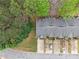 Aerial view of townhomes with gray roofs, individual driveways, and surrounded by lush trees at 3355 Waldrop Trl, Decatur, GA 30034