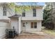 Back exterior features white siding, a door, windows, and an air conditioning unit at 3355 Waldrop Trl, Decatur, GA 30034