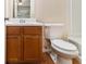Small bathroom with laminate flooring, wood vanity, and toilet at 3355 Waldrop Trl, Decatur, GA 30034
