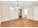 Dining room featuring hardwood floors, neutral walls, and several doorways at 3355 Waldrop Trl, Decatur, GA 30034