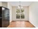 Dining room with hardwood floors, neutral walls, and a view to the yard at 3355 Waldrop Trl, Decatur, GA 30034