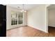 Dining room with hardwood floors, neutral walls, and a chandelier at 3355 Waldrop Trl, Decatur, GA 30034