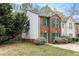 Charming two-story brick townhouse with green shutters and a well-maintained side yard at 3355 Waldrop Trl, Decatur, GA 30034