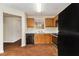 Kitchen featuring stainless steel appliances, wooden cabinets, and hardwood floors at 3355 Waldrop Trl, Decatur, GA 30034