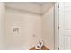 Practical laundry area with hookups, wire shelving, and wood-look flooring at 3355 Waldrop Trl, Decatur, GA 30034