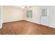 Bright living room features wood-look floors, and a window at 3355 Waldrop Trl, Decatur, GA 30034