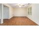 Bright living room features wood-look floors, a ceiling fan, and a window at 3355 Waldrop Trl, Decatur, GA 30034