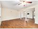 Spacious living room featuring wood-look floors, a ceiling fan, and plenty of natural light at 3355 Waldrop Trl, Decatur, GA 30034