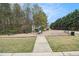 Community playground area with benches and play structures surrounded by grassy area at 3355 Waldrop Trl, Decatur, GA 30034