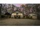 Charming home features a symmetrical design, and a separate garage with a covered walkway at 5 Colonial Club Se Dr, Acworth, GA 30102