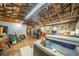 Garage interior featuring a hot tub and a workbench, offering relaxation and hobby space at 5 Colonial Club Se Dr, Acworth, GA 30102