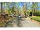 Private gated entrance to a secluded property surrounded by lush greenery at 5 Colonial Club Se Dr, Acworth, GA 30102