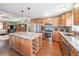 Spacious kitchen features custom island with wine rack, stainless steel appliances and gorgeous granite countertops at 5 Colonial Club Se Dr, Acworth, GA 30102