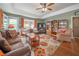 Cozy living room with hardwood floors, built-in shelves, and access to the outdoor area at 5 Colonial Club Se Dr, Acworth, GA 30102