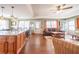 Open living space merging kitchen and living areas for easy entertaining, highlighted by hardwood floors and natural light at 5 Colonial Club Se Dr, Acworth, GA 30102