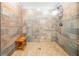 Walk-in shower boasts custom tile work, a bench and dual shower heads creating a spa-like retreat at 5 Colonial Club Se Dr, Acworth, GA 30102