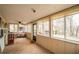 Bright sunroom with large windows offering backyard views and relaxed seating, creating a serene retreat at 5 Colonial Club Se Dr, Acworth, GA 30102