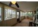 Bright sunroom filled with natural light, featuring multiple windows and neutral decor at 5 Colonial Club Se Dr, Acworth, GA 30102