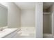 Bathroom with a shower and tub combo offers a relaxing bathing experience at 3094 Calumet Nw Cir, Kennesaw, GA 30152