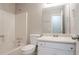 Bathroom offers a tub-shower combo, a wide vanity, and a large mirror, perfect for a refreshing start at 3094 Calumet Nw Cir, Kennesaw, GA 30152