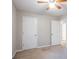Comfortable bedroom featuring multiple closets for ample storage and neutral wall color at 3094 Calumet Nw Cir, Kennesaw, GA 30152